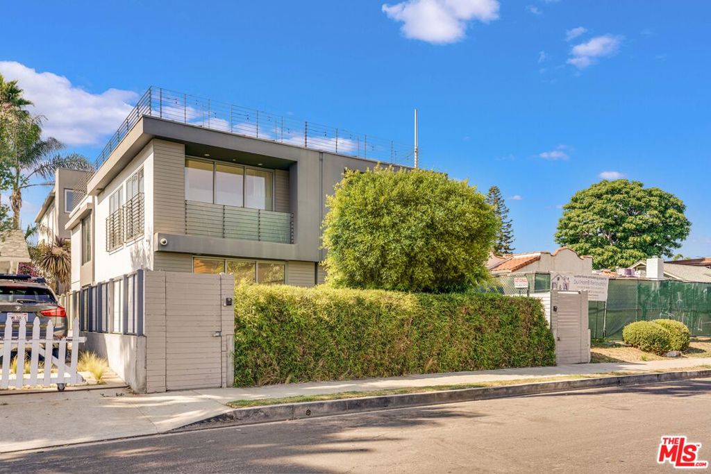 Architectural stunner in the heart of Venice! Nestled between Abbot Kinney, Rose Avenue, and Lincoln Boulevard, this nearly 2,600 sq ft modern masterpiece offers the best of design, space, and location. With high ceilings and light-drenched interiors, the home features a flexible, open floor plan ideal for today's lifestyle. In addition to the expansive main living room, the second floor includes two versatile flex spaces perfect for a home office, creative studio, playroom, or media den. Two bedrooms are conveniently located on the second level, while the third floor is dedicated entirely to a luxurious primary suite. Designed for both comfort and privacy, the home offers three and a half beautifully appointed bathrooms, including two en-suites, a sleek full bath adjacent to the second bedroom, and a chic powder room on the first floor. Wide-plank French oak flooring runs throughout, and a dramatic glass wall near the stairwell enhances the home's bright, open feel. Step outside to enjoy a sunset from your rooftop deck or unwind on the second-floor front-facing patio. Every detail has been considered from premium sliding doors and a chef-worthy custom kitchen with built-in refrigeration and top-tier appliances, to an oversized 2-car garage that doubles as a gym or potential detached office. Plus, there's off-street parking for two more vehicles. The spa-like primary bath features a frameless glass shower, soaking tub, dual vanities, and a massive walk-in closet. Eco-conscious amenities include electric vehicle charger capability and a graywater rain capture system. This is Venice living, elevated.