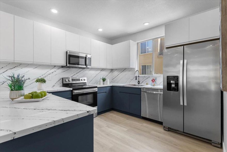 EXQUISITE BLEND of STYLE, COMFORT & SOPHISTICATION *** HOA allows for A/C install *** Surrounded by a vibrant array of shops & dining options, close to Santana Row, Santa Clara Square & w/park 1 block away, this newly remodeled townhome is nestled out of sight  ***  Newly remodeled w/European style expansive kitchen featuring quartz countertops, S/S appliances, a breakfast bar, & warm under cabinet lighting *** Accent shiplap wall & contemporary remodeled fireplace seamlessly tie the extra wide living & dining spaces together *** TWO en-suites *** Walk in closet in primary suite w/a luxurious European style shower, dual sink floating vanity w/accent under cabinet lighting, acoustic wood wall paneling *** Huge second en suite w/contemporary design *** Cathedral ceilings *** Accent lighting in primary suite & in hallway niches add warmth *** New flooring & paint throughout *** Skylight *** Cathedral ceilings *** Recessed lights *** Dual pane windows *** In wall forced air electric heater w/energy efficient individual room controls *** 2 Car garage w/extra storage *** Save on Santa Clara UTILITIES  (no PG&E to deal with) *** HOA covers water *** Pride of ownership *** HOA allows for AC installation (see disclosures) *** This, is living redefined - welcome home!!