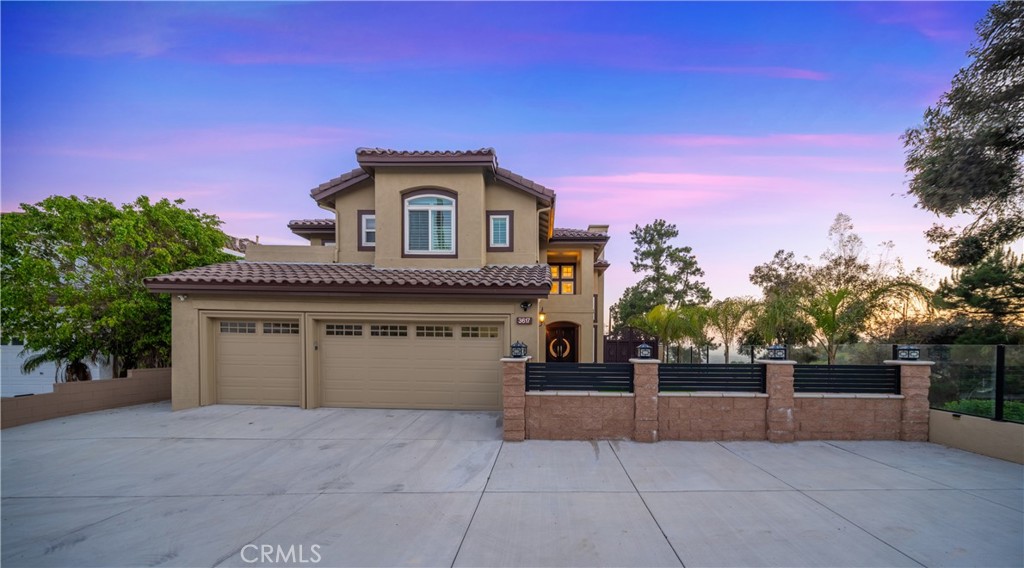 Nestled in the rare and sought-after enclave of Vantage Pointe in Rowland Heights, this meticulously upgraded single-family home seamlessly blends thoughtful functionality with refined elegance. With 4 bedrooms, 4 full bathrooms, and approximately 2,692 sq.ft. of living space, this residence is an exceptional offering for buyers who value both style and substance. The smart floor plan is ideal for multigenerational living or accommodating guests: Upstairs: 3 private en-suite bedrooms, providing comfort and privacy. Downstairs: 1 additional bedroom and 1 full bath, perfect for in-laws, guests, or a home office. Situated at the end of a quiet cul-de-sac, this home enjoys unmatched tranquility and privacy. The expansive front yard offers generous parking, while the elevated backyard captures panoramic city lights and mountain views, offering a serene yet majestic backdrop. Premium Upgrades & Features Include: Brand-new roof and dual-pane energy efficient windows and sliding doors for enhanced insulation and soundproofing. Newly installed dual-zone central HVAC system with separate controls for upstairs and downstairs. Elegant marble flooring throughout the first floor, and premium hardwood floors upstairs. Dazzling crystal chandeliers add a touch of grandeur and luxury. Custom European-style cabinetry and high-end marble countertops in the gourmet kitchen—crafted with precision and taste. All four bathrooms have been completely remodeled with designer finishes—balancing comfort, durability, and sophistication. Handcrafted crown moldings and wall paneling throughout the interior add layers of architectural detail and opulence. Brand-new PEX plumbing system and electrical panel upgrade for peace of mind. Professionally finished hardscaping in both front and backyard, reducing maintenance and creating opportunities for outdoor living or entertaining