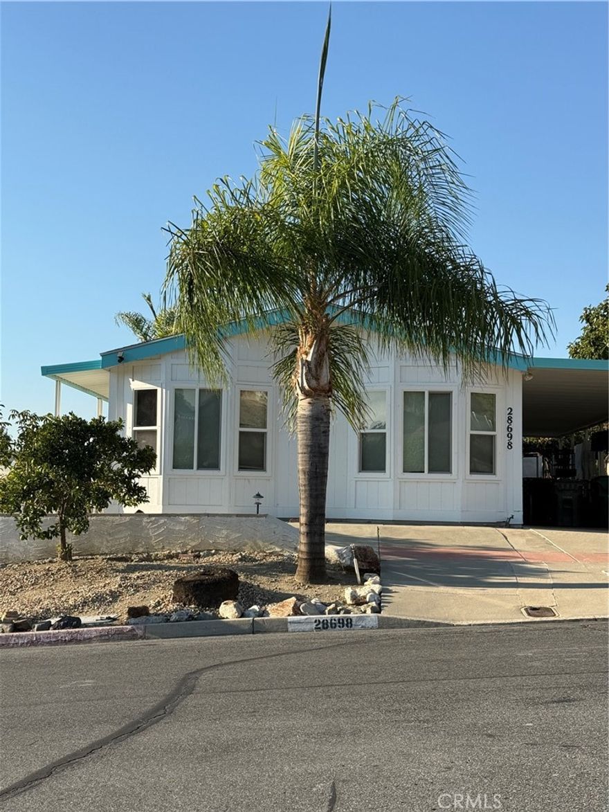 LOCATED IN A FABULOUS AND SERENE 55+ COMMUNITY.  THE LAND IS ALSO INCLUDED WITH THIS PROPERTY!  3 BDRM/2 BATH  1296 SQ. FEET, BLT IN 1988, PERMANENT FOUNDATION RECORDED W/COUNTY, LOW TAXES, LOW HOA.  THIS HOME IS ALL OF THESE THINGS.  GREAT W/DINETTE AREA, KITCHEN WITH GRANITE COUNTER TOPS.  THIS HOME HAS A LOT OF POTENTIAL FOR SOMEONE WHO HAS SOME TIME, KNOWLEDGE, FRIENDS AND WOULD LIKE TO DO SOME WORK TO CREATE YOUR DREAM HOME.  GREAT FRIENDS TO BE MADE, POOLS WAITING FOR YOU TO SWIM IN, BBQ'S AND PARTIES TO ATTEND.   ENJOY YOUR RETIREMENT IN THE KNOLLS MFG. HOME COMMUNITY.   SEE REMARKS.