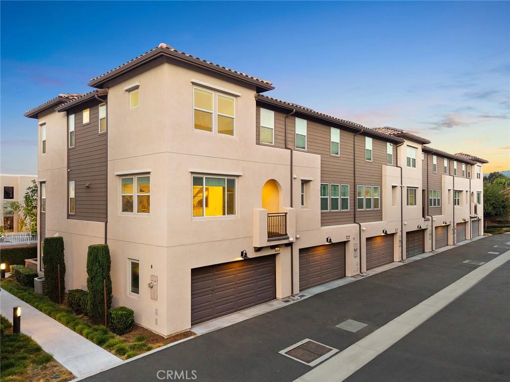Discover a masterpiece of modern living in this impeccably maintained PUD, built in 2020 and radiating the pristine allure of new construction! Nestled within a secure gated community, this stunning corner unit boasts trendy décor and upscale finishes, enhanced by over $46,000 in improvements. Offering 4 spacious bedrooms, 3.5 beautifully appointed bathrooms, and direct 2-car garage access, it’s perfect for growing or multi-generational families. Step inside to a flood of natural light cascading across each level.The entry level is versatile, featuring a bedroom and 3/4 bathroom ideal for guests, in-laws, or a private home office. The heart of the home lies on the second floor, where an open-concept layout centers around a breathtaking oversized kitchen island with luxurious Super White Dolomite waterfall countertops and a matching backsplash, sleek cabinetry, a Kraus farmhouse sink, and antique champagne bronze Kraus kitchen faucets to match. Wait until you see this gorgeous kitchen—photos don’t do it justice! The expansive living room accommodates large family gatherings, complemented by a stylish powder room. Upstairs, three generously sized bedrooms, each with ceiling fans, include a primary suite with a spa-inspired bathroom featuring dual sinks and a junior suite with its own private bathroom, all elevated by premium upgraded flooring. The primary also features a walk-in closet with natural light and a custom closet storage system. Additional amenities include a Google Nest doorbell, Eufy keyless front door entry, fresh interior paint, new baseboards, dual-pane windows, central air conditioning, water softener, reverse osmosis drinking water system, new carpet in the storage room and on the stairs, and luxury vinyl throughout.The complex is just 2 miles from Whittier Narrows Recreation Area, where families enjoy scenic trails, lakes, and family-friendly activities like bike and pedal boat rentals. San Gabriel Valley’s vibrant dining, parks, and cultural hotspots are also at your fingertips, including the highly regarded El Monte public schools, all within 0.5 to 1.5 miles for stress-free school runs. Low monthly HOA dues of $276 cover trash, exterior maintenance, community lighting, pest control, and amenities such as a dog run, BBQ areas, lush landscaping, a children’s tot-lot, and a cozy fireplace clubhouse (no pool). Don’t miss your chance to own this 5-year-new construction—schedule a tour today and step into a world of modern elegance!
