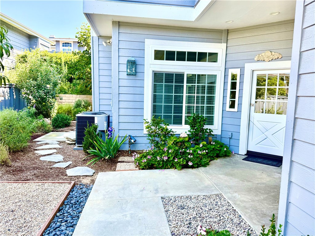 Be the first to live in this charming meticulously remodeled showplace located in the highly desirable Terraces of Corona del Mar! Upon entry to this rare, lower level, single story, no interior steps, home you will see and feel the abundance of natural sunlight. No detail has been overlooked. The beautifully remodeled kitchen features new stainless-steel Kitchen-Aid appliances, American Woodmark cabinets with under cabinet lighting, and new kitchen sink with Pfister faucet. The kitchen cabinets and drawers are soft closing. Designer chosen Viatera quartz highlight the kitchen counters and backsplash. High end finishes include a custom paint job, new baseboards, and new LUX luxury floors which lend a modern design with durability and comfort. The spacious master bathroom has a gorgeous oversized walk-in shower and stone floor with all new frameless glass and a luxurious soaking tub, surrounded by Italian porcelain. Next to the master bathroom is an ample walk-in closet. Both bathrooms have new dual sink vanities, toilets, Moen faucets, and mirrors. Other features include new heating and AC unit, recessed LED lighting, ceiling fans, light fixtures and raised panel doors. All new window treatments throughout including a rolling black out shade in the master bedroom. New Milgard windows and sliders. The living room and master suite sliders open out for a seamless indoor-outdoor transition. The living room has a cozy fireplace and new mantle. Eat in the dining room or at the informal nook off the kitchen. The second bedroom and bath are located on the opposite side of the home offering privacy for office use and guests. The laundry room has plenty of storage and a new vanity. The attached two car garage has new paint and epoxy flooring. The gated front courtyard is one of the largest in the complex featuring a perfect combination of functional and tranquil outdoor space with an entertainment area to enjoy the beautiful coastal weather. New landscaping with an English perennial garden and reap the benefits of fresh fruit from your fig, apple, persimmon and peach trees. The association pool which is heated year round, spa,clubhouse,and scenic trails are all close by. The Oasis Senior Center with so many activities is located nearby. A short distance to pristine beaches, dining and shopping in Corona del Mar,Fashion Island and Crystal Cove. To live in The Terraces one resident must be over 55. No smoking. Everything you've been looking for and so much more!