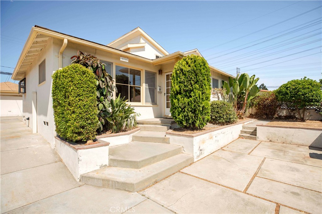 Welcome to 19205 Entradero Ave — a spacious West Torrance home offering 2,166 square feet of opportunity in one of the South Bay’s most desirable neighborhoods. Set on tree-lined street, this home blends livability with long-term potential. With three bedrooms located downstairs, including an ensuite ideal for guests or multigenerational living, and two more bedrooms upstairs, the flexible layout is perfect for growing families, home offices, or reimagined living spaces. Upstairs, one bedroom features soaring ceilings and abundant natural light, while the other offers the feel of a spacious retreat that — ideal for those seeking privacy, relaxation, or a luxurious redesign. A bright sunroom with sweeping views completes the upper level, offering a serene escape perfect for reading, working, or enjoying sunsets. The detached garage presents excellent ADU potential, adding further value and versatility to this already expansive property. With new carpet and fresh paint throughout, you can move in comfortably now and design over time. Located just minutes from award-winning schools, Entradero Park, and the beach, this is a rare opportunity to create something truly special in West Torrance.