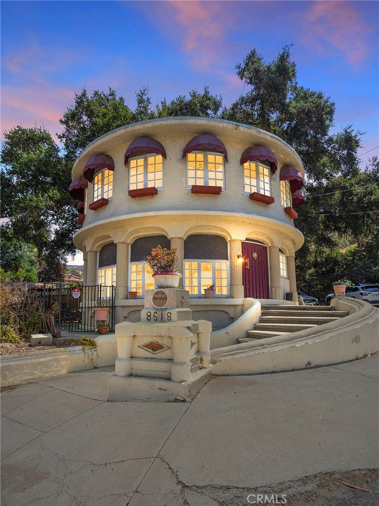 Welcome to this truly unique property in La Tuna Canyon! This one-of-a-kind round house is a standout, offering a blend of charm, style, and functionality. With 1,544 square feet of living space, this home boasts 3 spacious bedrooms and 2 bathrooms, making it perfect for family living or as a retreat in a peaceful and scenic environment. The home’s design includes a coved ceiling that adds a distinctive touch, along with a formal dining room for memorable meals and gatherings. The remodeled kitchen is equipped with modern amenities and features a cozy dining area. You'll love the easy-to-maintain pergo flooring, which flows seamlessly throughout the living spaces, and the laundry area for convenience. Step outside to the covered patio, offering an ideal setting for relaxation or entertainment, with views of the surrounding foothills and mountain views that are sure to impress. Whether you’re a nature lover, an entertainer, or someone seeking privacy, this home checks all the boxes. You’ll have plenty of parking with 2 gated uncovered spaces, plus room for your RV. This horse property is ideal for equestrian enthusiasts. Don’t miss your chance to own this exceptional, one-of-a-kind property. Schedule your viewing today and experience the charm and uniqueness of the round house for yourself! LA tax assessor shows 3 bedrooms and 1 bathroom.