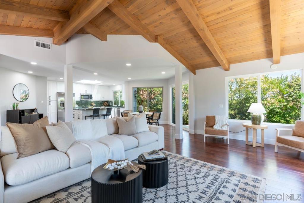 Stop your search—this is the one! Welcome to 907 Ridge Heights Road, an exceptional, beautifully remodeled residence offering 2,387 sq ft of elevated living in one of Fallbrook’s most desirable gated 55+ neighborhoods. Remodeled in 2025 with all new appliances, this unique home features 3 bedrooms with an optional fourth, including two expansive primary suites—one conveniently located on the first floor. Set at the end of a quiet cul-de-sac with sweeping views of Palomar Mountain, it blends elegance, comfort, and privacy in one unforgettable package. Inside, enjoy soaring vaulted wood beam ceilings, updated designer finishes, and a spacious walk-in closet with custom built-ins. A spa like primary bathroom adds a touch of resort-style luxury, featuring a steam shower and a standalone soaking tub—perfect for unwinding after a long day. Step into your private backyard oasis, where a large, tranquil waterfall sets the tone for relaxation. Entertain under powered sunshades and awnings that cover a fully equipped outdoor kitchen with a sink, grill, two burners, and a flat top. Gather around the fire table or enjoy fruit from your own mature trees—peach, apple, and kumquat—while taking in the peaceful mountain views. On the market for the first time in 15 years and arguably the best home in the entire community, this is a rare opportunity you don’t want to miss.