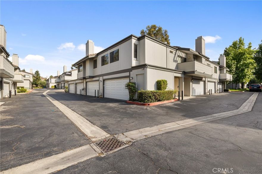 SELLER PROVIDING BUYER $5,000 CREDIT TOWARDS A RATE BUY DOWN. Beautifully updated 2 bed, 1.5 bath corner-unit condo in the desirable Sandalwood Village of Simi Valley. Full corner-unit privacy with only one shared wall, vaulted ceilings, and premium waterproof laminate flooring throughout. Private two car garage with extra storage and an EV charger. The spacious living room features high ceilings, abundant natural light, a cozy fireplace, and an open layout that flows seamlessly into the dining area and oversized balcony with peek-a-boo mountain views. Updated kitchen with quartz countertops, shaker cabinets, and farmhouse sink. Large primary bedroom with ensuite walk-in shower; generously sized second bedroom. In-unit laundry and ample closets.  Upgraded electrical panel with whole-home surge protection and capacity for solar, backup battery, or generator. The home is fully wired for Ethernet with network ports installed, ready for high-speed internet and reliable wired connections. 

Community amenities include resort-style pools, spas, tennis courts, and landscaped park-like grounds. HOA covers water, trash, sewer, exterior maintenance, pest control, and earthquake/fire insurance. Convenient to 118 freeway, schools, shopping, dining, and parks. Freshly painted, ready for move in.
