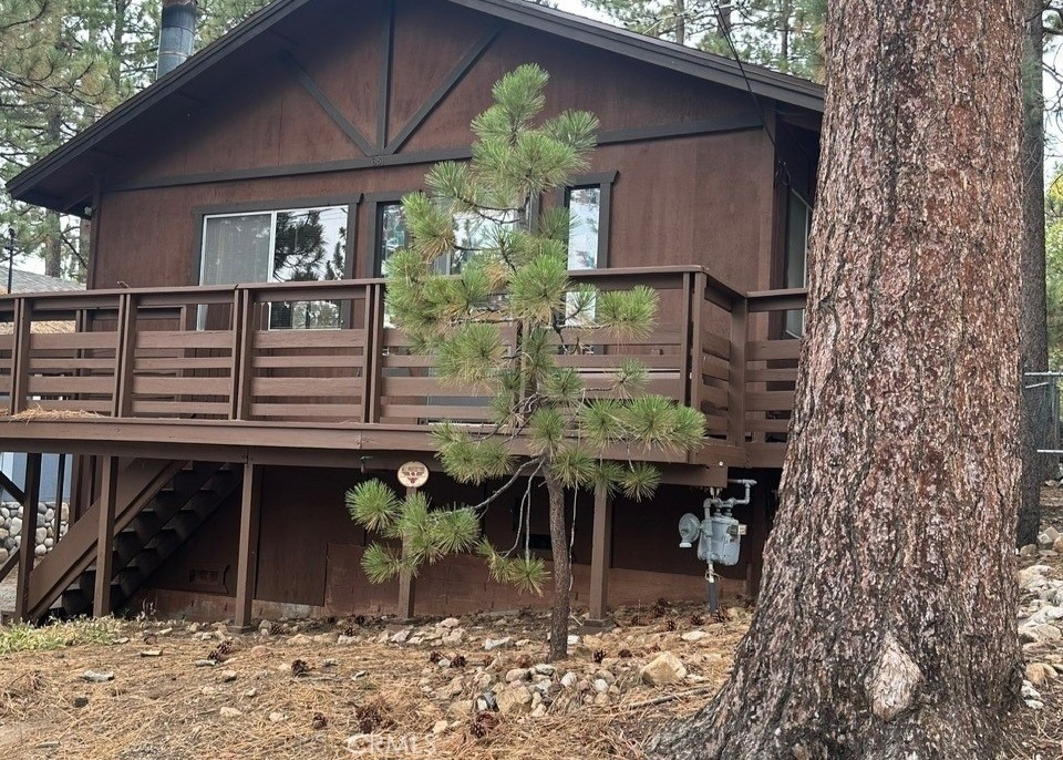 Quaint Rustic Cabin – Prime Location! Welcome to this charming 2-bedroom, 1-bath home, lovingly cared for by its original owners. Nestled in a woodsy setting yet conveniently close to town, this cozy retreat offers the perfect blend of mountain charm and accessibility. Featuring an open floor plan with 864 sq. ft. of living space, the home feels bright and inviting with plenty of natural light throughout. The rustic character shines with original details, offering a great opportunity for buyers to update or keep its vintage mountain style. Set on a 2,500 sq. ft. lot surrounded by trees, the property provides a peaceful getaway atmosphere while being near shopping, dining, and all of Big Bear’s year-round activities. No garage or laundry hookups, but plenty of potential to make it your own mountain escape. Whether you’re looking for a cozy full-time residence, a weekend retreat, or an investment opportunity, this little gem has endless possibilities!