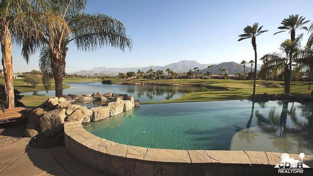 This stunning Mountain View Country Club vacation home is perfectly situated for you to enjoy awesome panoramic mountain and lake views.The open 4 bedroom with casita floor plan makes it perfect for entertaining, with a large kitchen that flows into the great room and extends outside onto the backyard patio. Perfect to enjoy the private infinity pool and spa. The super-sized primary bedroom with en-suite bath is perfect with a soaking tub, walk-in shower, dual sinks and a large walk-in closet. The guests bedrooms are large and well appointed. And the theater room is a show stopper! When your day is done you can enjoy preparing meals with family and friends on the custom built in BBQ and dining under the stars with views of the golf course, lake and picturesque mountain backdrop at sunset. Golf membership is available for transfer. See all photos.