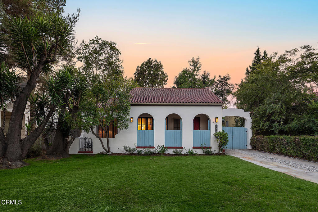 Located in coveted South Pasadena, this 1923 Spanish-style cottage has substantial intact original charm and endless potential for the future. With its red tile roof, arched portico over the driveway, and the trio of arches that create the front porch, the curb appeal is straight out of a storybook. Inside, you'll find a spacious and light-filled floor plan with 2 bedrooms, 2 bathrooms, and timeless architectural details including hardwood floors, coved ceilings, original French doors and wood windows. The warm and welcoming living room with beautifully tiled fireplace flows into a formal dining area, offering great bones for both entertaining and everyday living. The kitchen and baths retain vintage character, while thoughtful system updates - including a 200-amp electrical panel and updated wiring throughout the home, upgraded heating, and central air conditioning (2022) - ensure year-round comfort and reliability. Step outside to a private backyard retreat, shaded by mature trees and enhanced with vibrant artificial turf for effortless enjoyment. Whether you're hosting dinner al fresco, relaxing under the canopy, or dreaming of an ADU or garden studio, this generous outdoor space invites creativity and connection. A detached garage and long gated driveway provide ample off-street parking and storage. All this, just blocks from Garfield Park, award-winning South Pasadena schools, Mission Street shops and cafes, and the Metro Gold Line. With its ideal location, architectural charm, and room to grow, 1707 Garfield Avenue is a rare opportunity in one of the most beloved communities.