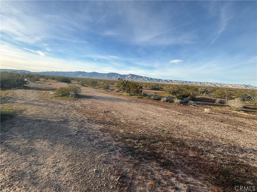 Endless potential on this 2.5-acre residential-use lot in Mojave, conveniently located near Highway 58. Perfect for future building, a desert retreat, or long-term investment. The area has nearby water infrastructure, offering added convenience as you explore development possibilities. Wide skies, level ground, and great accessibility make this a standout parcel. Buyer to verify zoning, utilities, and intended use.