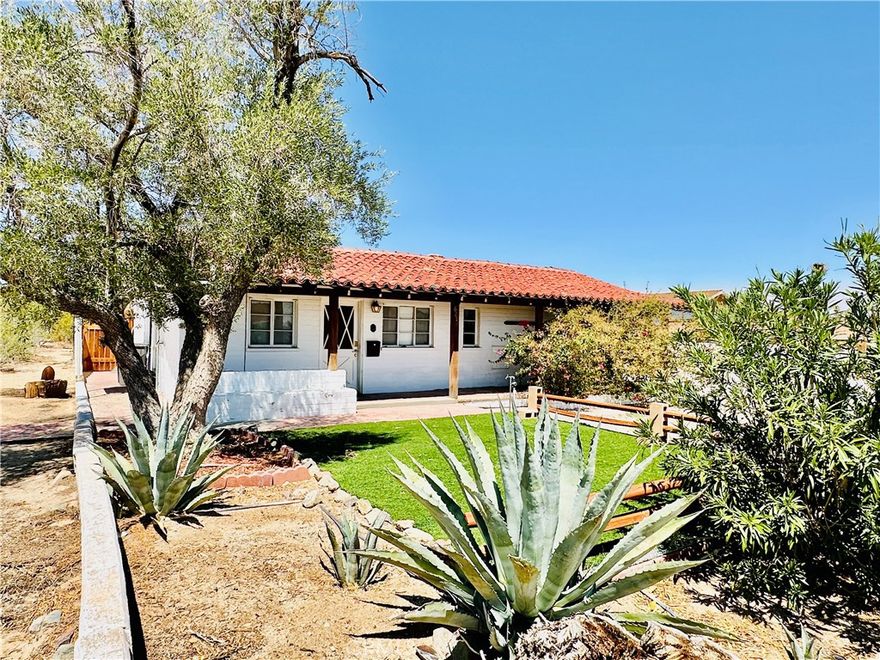 Truly unique, one-of-kind 1950’s Spanish style home situated minutes from the North Entrance of Joshua Tree National Park. Close to everyday conveniences - markets, shops, and neighborhood restaurants. Included in the sale is a neighboring lot with separate APN and unlimited potential. Build SECOND home right next door! Must see to appreciate, original home boasts so much character: vaulted wood ceilings, terra-cotta tile roof, observation deck, enclosed patio with Jacuzzi, original brick oven in the kitchen! You can keep looking, but you won’t find another one like this.