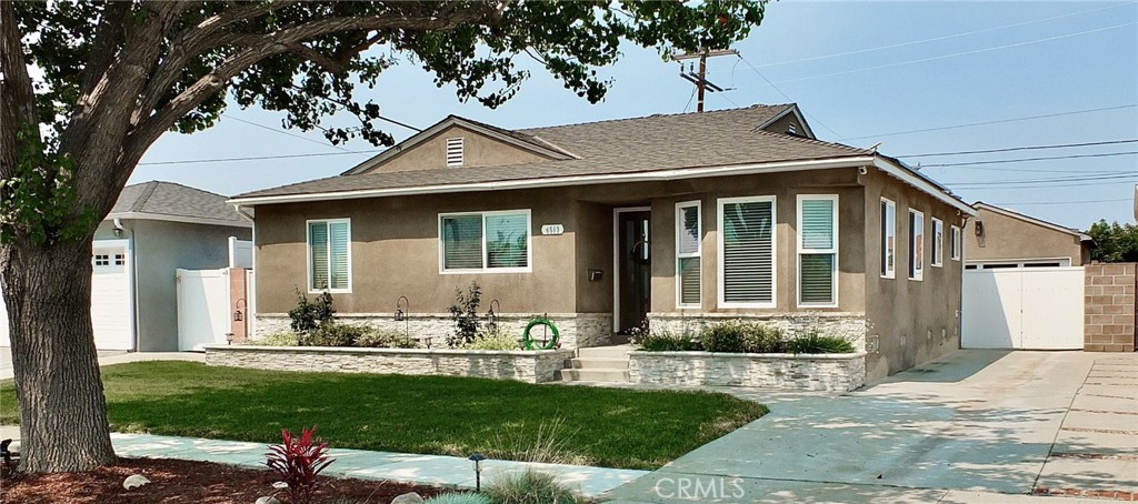 upgraded 4-bedroom 3-bathroom house with detached 2-car garage.