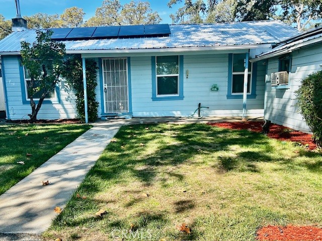 Charming Home in the Terraces Subdivision!  This well-maintained two-bedroom, one and a half bath home is located in the highly sought-after Terraces subdivision in Lakeport, conveniently close to local schools. The main house includes a bonus storage room, offering extra space for your belongings, as well as a detached guest unit. Bonus room has outside door leading to back yard and privacy fenced area.  The guest unit features a full bathroom and its own private entrance, making it ideal for visitors or extended family.  Sitting on a fifth of an acre, this street-to-street terraced lot boasts a beautifully landscaped front yard and spacious back yard area, perfect for a pool and a large garden area! There is ample parking available, with plenty of space to accommodate your cars and boats.  Equipped with solar power and multiple mini split units, this home ensures energy efficiency throughout the year. Additional upgrades include dual pane windows and a newer metal roof, providing comfort and durability.  This property is being offered for the first time in over 30 years, presenting a rare opportunity to own a home in this desirable neighborhood.  Terraces subdivision offers access to two docks and a beach on the lake for a low annual fee.