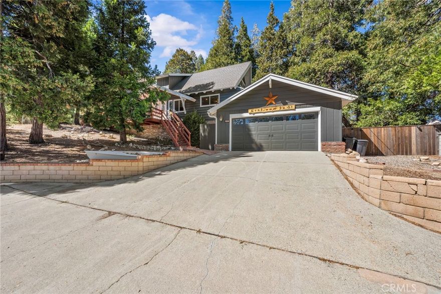 Cozy Mountain Retreat with Lake Rights & Year-Round Charm!                                  Located just minutes from Lake and Village.



Welcome to your Lake Arrowhead escape — a beautifully maintained 4 bed, 2 bath home (2,110 sq ft) designed for comfort, entertaining, and mountain living at its best.



Enjoy the quarter acre lot,  freshly painted exterior, and a fully fenced backyard! There is plenty of room for your toys to go with those lake rights!  — including an expansive driveway, a large 2-car garage with storage lofts and a workshop.



Step inside to find beautiful exposed beams, a stone fireplace that is perfect for the winter months, and wood floors throughout with no carpet in sight! The updated bathrooms blend modern touches with cozy mountain charm. The main-level primary bedroom opens to your serene backyard, complemented with tree views all around.



Entertain with ease on the spacious front and back decks, dine al fresco, or unwind under the stars in your private hot tub.



With central cooling and heat, a whole-house generator, and a 200-amp upgraded panel, this home is perfect as a full-time residence, vacation getaway, or income-producing investment. Opportunity awaits!