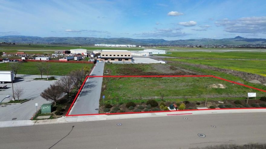 Prime 1-acre airport-accessible industrial lot on Airway Drive, Hollister, CA, zoned Airport Support (AS) and strategically located next to Hollister Municipal Airport (KCVH). This property offers potential direct airport access, subject to City of Hollister approval, making it an ideal opportunity for aviation-related businesses, warehousing, manufacturing, or logistics. Hollister Municipal Airport features a 6,350-foot primary runway and a 3,149-foot secondary runway, with full-service FBO support, fuel services, and uncongested airspace for seamless operations. With utilities available and easy access to Highways 25, 156, and 101, this lot is a rare investment opportunity in a growing industrial hub.