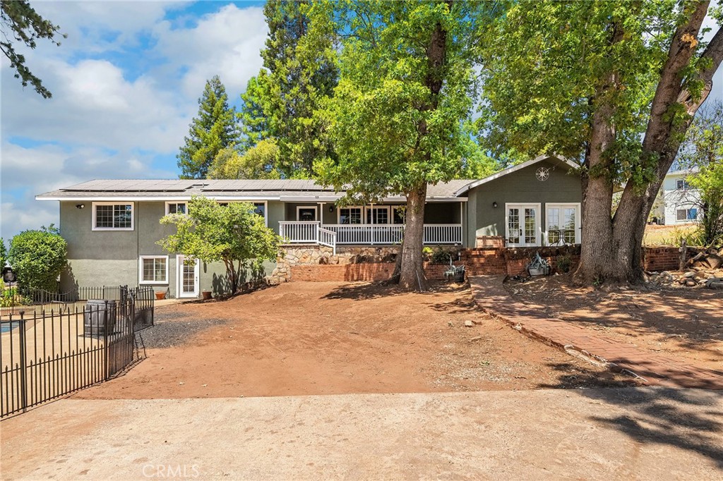 Secluded Paradise Gem with Room to Roam! Tucked away on a peaceful 1-acre lot in the heart of downtown Paradise, 520 Fir Street offers a rare mix of privacy, space, and location. With 3,460 sq ft of thoughtfully designed living space, this home is perfect for those who need room to live, work, entertain and play. Inside you’ll find 4 spacious bedrooms, 3.5 bathrooms, plus a bonus room, family room, living room, a downstairs living area, office space, and a play zone — this layout is as flexible as it is functional. And did we mention the abundant storage? More features to love include, owned solar for energy savings, swimming pool for your own private summer hangout, charming front porch to sip and unwind and plenty of room for a shop, gardens, outdoor oasis, you name it. This is not just a home — it’s a lifestyle. With this much space and so many amenities, it’s an absolute steal at this price. Come see the best kept secret in downtown Paradise!