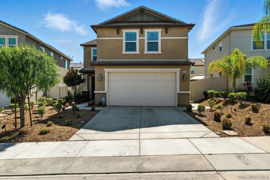 Welcome to this beautiful, spacious home on the West side of Santee! Offering 2100 sq. ft. of thoughtfully designed living space, this 3-bedroom, 2.5 bathroom residence blends comfort and modern convenience. Downstairs features an open concept layout with modern flooring throughout creating a seamless flow between the living, dining, and kitchen areas; perfect for both everyday living and entertaining.  Upstairs, you'll find a generous primary suite featuring two closets, along with a versatile loft, and a spacious laundry room for added ease. The home is equipped with a gas range, modern appliances, a tankless water heater, 2 zoned ac system, and paid solar panels to keep energy costs in check. The epoxy-coated garage floor adds a sleek, durable finish, while the backyard is set up perfectly for entertaining with low-maintenance turf. Nestled in a quiet, well-kept neighborhood, this home offers both functionality and style—ideal for relaxed living and hosting family and friends.