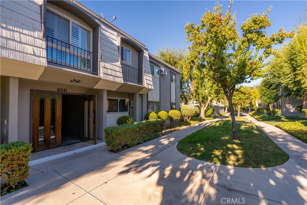 This desirable end unit is situated in one of the best locations within the entire community offering added privacy with no neighbors above and only one shared wall. Step inside and you’ll immediately notice the pride of ownership. The home features a stylish accent wall, a modernized kitchen, and was freshly painted just weeks ago. The inviting patio provides the perfect space for outdoor lounging or entertaining. Parking is convenient with a covered carport just steps from your door, and additional spaces are available if needed. This HOA is packed with value: water, trash, and even annual in-unit maintenance are included along with well-kept community grounds, access to two swimming pools, a playground and a basketball court. Located in one of the most sought-after areas of the San Fernando Valley at Warner Center, you're just minutes from the renowned Westfield Topanga Mall, Costco, a wide variety of restaurants, local markets, and Ventura Blvd. This is your opportunity to rent in a vibrant, well-maintained community with unbeatable convenience. Don't miss out!