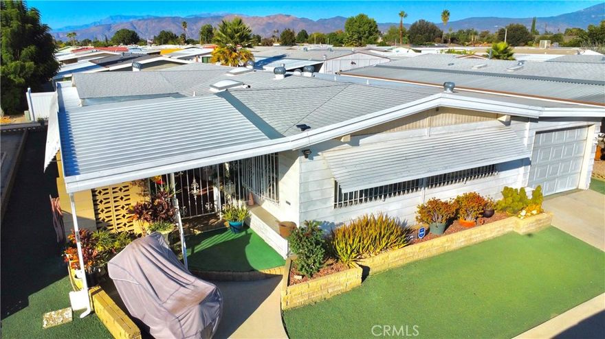 *Own the Land* (Financing available) Check out this Spacious and inviting home located in the desirable Sierra Dawn 55+ community of Hemet! This expansive 3-bedroom, 2-bath residence offers generous living space with two large living rooms and a versatile bonus room that can easily serve as a workshop or hobby area. The primary suite features a long walk-in closet, providing ample storage and comfort. Enjoy the convenience of a private gated porch for added security and a rare attached garage that accommodates one car plus up to two motorcycles. The Sierra Dawn HOA, at just $186 per month, offers fantastic amenities including RV parking for owners. With its size, layout, and unique features, this home stands out as one of the larger and more functional properties in the community—perfect for those seeking comfort, space, and convenience in a welcoming neighborhood. THE HOME HAS RECENTLY BEEN RE-INSULATED THROUGH THE ATTIC SPACE AND EXTERIOR PLEASE REFER TO PHOTOS. ROOF IN GREAT CONDITIONS. AC CONDITIONING SYSTEM IS IN GREAT CONDITION. THE 3RD BEDROOM IS AN ADD ON TO THE HOME FULLY ENCLOSED AND INSULATED.