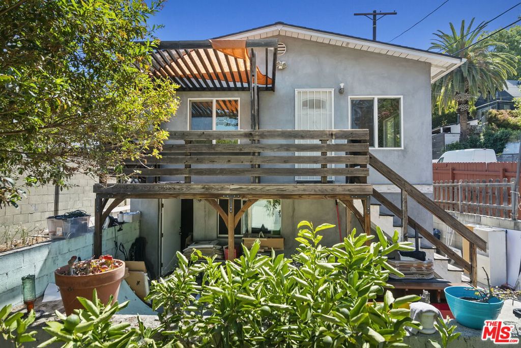 Tucked away in Elysian Heights, this charming 1921 bungalow offers an abundance of character on a quiet little street. With hardwood floors, light-filled living spaces, and classic charm this special home awaits its new owner. This home could be a great fit for a first time buyer willing to handle some cosmetic work, or an investor wanting to take on a large project. Zoned LAR2 you could build a second unit on the property or expand the existing structure. The home was fully renovated in 2009 when the seller purchased it and has updated systems, central air and heat and the home is in good shape. There appears to be existing foundation that was built outside the home for a possible expansion that was never done, so there could be cost savings to expanding the footprint and adding more square footage. This home is in a prime neighborhood and close to all the shops, bars and restaurants in Silver Lake, Frogtown and Echo Park. Don't miss the chance to make this house your home.