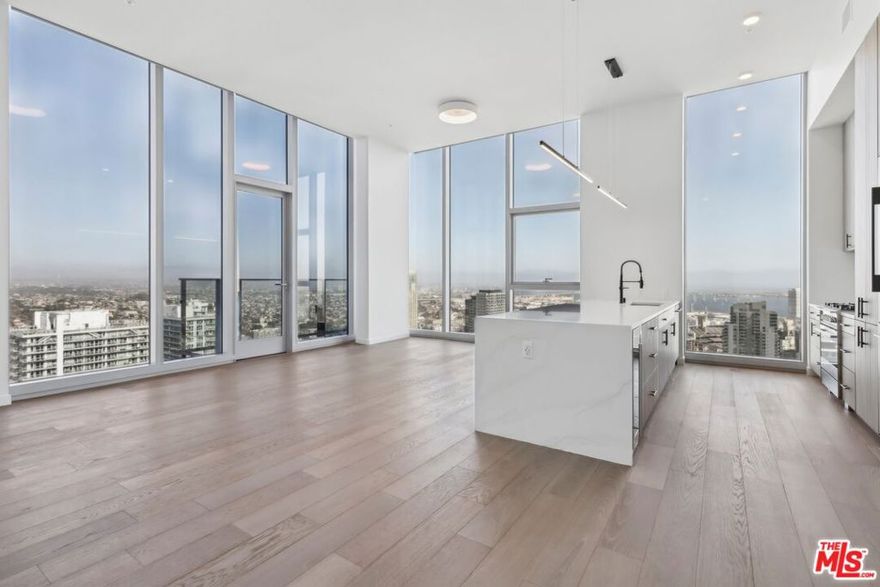 Welcome to the pinnacle of luxury living in the heart of Downtown San Diego at the 800 Broadway signature collection. This spectacular single level penthouse features 3-bedrooms and 2.5 bathrooms offering breathtaking panoramic views of both the cityscape and the bay. The gourmet kitchen showcases designer cabinetry with a premium Fisher & Paykel appliance package that includes an integrated refrigerator and under-counter wine refrigerator. Elevated ceilings in the open concept living area frame the sprawling city below, creating an unparalleled sense of luxury. The primary suite provides a seamless flow from the generous walk-through closet to an elegant ensuite bathroom, complete with dual vanities, a standalone soaking tub, and separate shower perfect for both relaxation and daily rituals. Two additional guest bedrooms with a shared ensuite bathroom and a side by side washer/dryer closet complete the residence. Exclusively situated on a dedicated penthouse level with just five residences, Penthouse No. 2 provides unparalleled privacy for discerning residents who desire both urban connectivity and tranquil retreat. Take advantage of exceptional community amenities befitting of a luxury residence, highlighted by San Diego's highest rooftop pool offering unmatched panoramic views. Experience the finest of urban living at 800 Broadway, where every detail has been crafted to complement the extraordinary views and a sophisticated lifestyle.