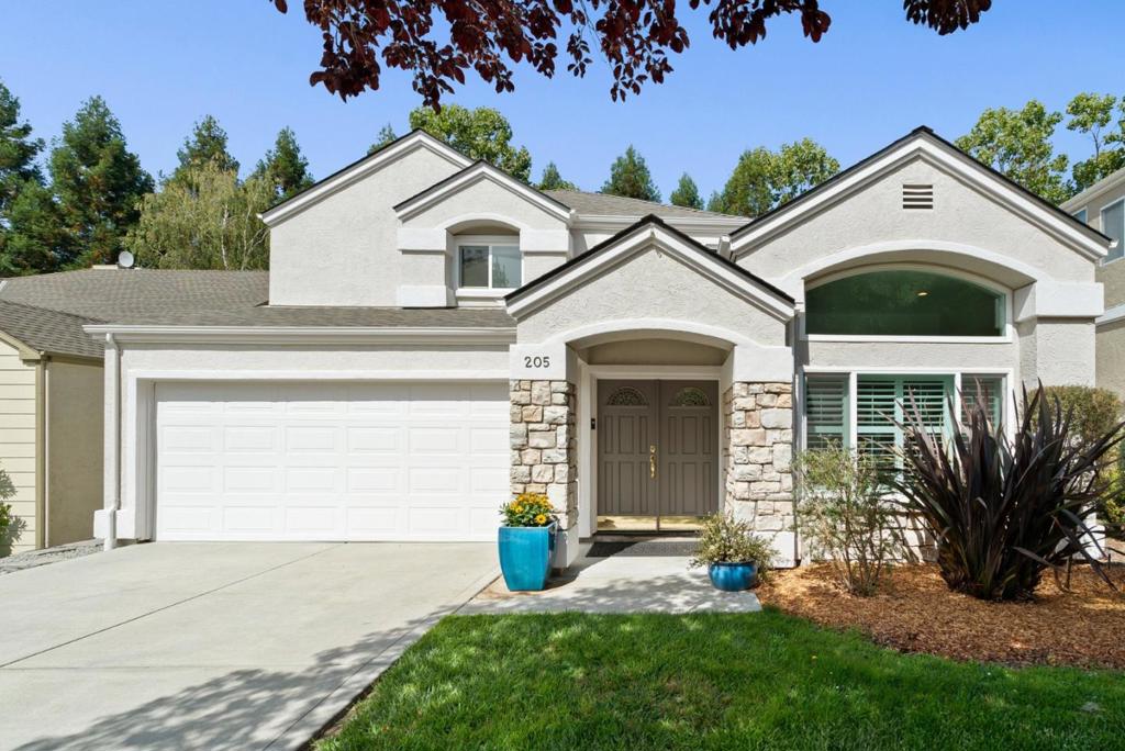 Welcome to Green Hills Estates! This picturesque community boasts quiet tree-lined streets, sleepy cul-de-sacs & sweeping views of the Santa Cruz Mountains. Nestled on a flat, sunny lot bordered by redwood trees sits 205 Sidesaddle Circle. This charming home features 2,144 sf of living space w/ 4 spacious bedrooms, 3 full baths & a flexible floor plan designed for modern living. Enter through the double front door into the expansive living/dining room w/ soaring vaulted ceilings & tons of natural light. The open-concept kitchen/family room connects seamlessly to the fully fenced backyard w/ artificial turf, garden area, BBQ patio & spa. Gorgeous chef's kitchen featuring a huge center island, plentiful storage & SS appliances. Also located on the ground floor is a bedroom w/ full bath. The expansive primary suite, two additional bedrooms & a full bath are all located upstairs. Additional highlights include a BRAND NEW ROOF, new Milgard windows & sliding glass doors, fresh interior & exterior paint, elegant wood flooring throughout, Puronics water treatment system, attached 2-car garage & flat driveway w/ room to park an oversized vehicle. Walking distance to hiking trails & a short drive to award-winning Scotts Valley schools, Santa Cruz beaches & Silicon Valley. This one's a 10!