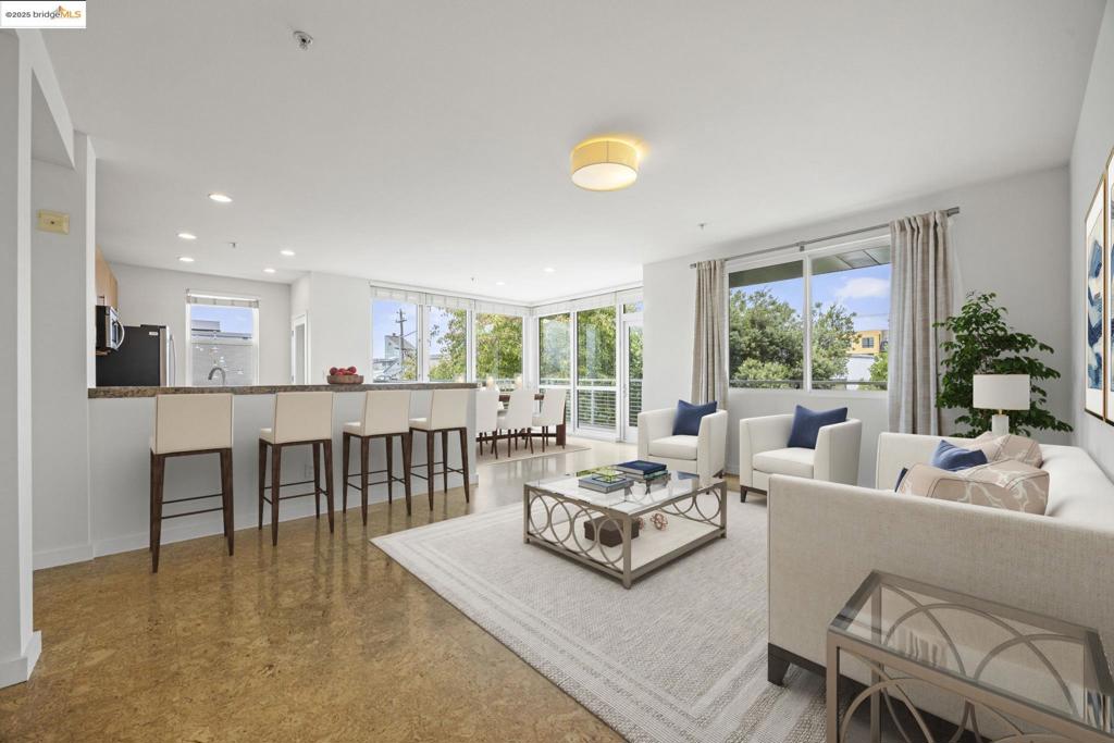 Welcome to the Harborwalk lifestyle at 3090 Glascock Street! Ideally located near the Bay Trail, this sleek 2 bedroom, 2 bathroom condo offers luxurious amenities in the hip Jingletown neighborhood. Walls of windows allow plenty of light into this rare corner unit. An entertainer’s dream, the kitchen opens to the bright and airy living and dining areas. Step outside on the wrap-around balcony surrounded by greenery and soak in the view. This one-of-a-kind condo also features in-unit laundry and a spa-like primary bathroom with double vanity. The Harborwalk community is pet friendly and includes secure parking with EV chargers, bike storage, and a state-of-the-art gym. Step outside into the friendly neighborhood and stroll along the estuary as rowers glide through the water. The scenic atmosphere is complemented by its convenience to Park Street in Alameda and transit options to anywhere in the Bay Area. Close to Jack London Square shops and restaurants, as well as the ferry to San Francisco. A must see!