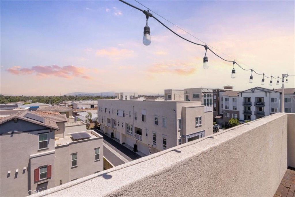 Welcome to 658 S Motif Street, a stunning modern condo in Anaheim’s vibrant Canvas neighborhood. This spacious 3-bedroom, 3-bathroom residence spans 2,178 square feet and offers contemporary living with high-end finishes, an open-concept layout, and abundant natural light. Built in 2021, the fully smart-enabled home features a gourmet kitchen with quartz counters and stainless steel appliances, ample storage, a dedicated laundry room, an attached 2-car garage equipped with a Tesla charger, custom storage cabinets and racks, and paid-off solar panels for energy efficiency and cost savings.
One of the standout highlights is the beautiful rooftop deck, perfect for entertaining or unwinding while enjoying breathtaking views of the nightly Disneyland fireworks—a magical touch that brings the enchantment of the park right to your doorstep.
Nestled in a resort-style community, residents have exclusive access to premium amenities including a sparkling pool, relaxing spa, and a clubhouse ideal for private events or gatherings. The location is unbeatable, with the Anaheim Packing District just steps away, offering an eclectic mix of dining, shopping, a farmers market, and a lively art scene. Explore nearby attractions like the Anaheim Equestrian Center for outdoor recreation, or take advantage of the proximity to major hotspots such as Disneyland Resort (only minutes away), Angel Stadium, Honda Center, and the Anaheim Convention Center—all while being adjacent to the Colony association for added community charm.
For food enthusiasts, indulge in walking-distance restaurants and eateries at the Packing District and beyond, including favorites like Craft By Smoke & Fire for mouthwatering barbecue, Puesto Anaheim for innovative Mexican cuisine, Poppy & Seed for fresh farm-to-table dishes, and En Familia for authentic flavors—all within easy strolls from your front door. Additional quick bites like The Pizza Press, Tony Roma’s, McDonald’s, and Subway are also nearby for everyday convenience.
This prime Anaheim gem combines luxury, location, and lifestyle—don’t miss the opportunity to call it home!