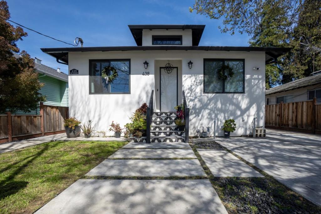 Welcome to this beautifully remodeled 3-bedroom, 2-bathroom home! A detached ADU offers an additional 450 sq ft of living space with one bedroom, one bathroom, A/C, and laundry--ideal for multi-generational living or potential rental income. Showcasing exceptional pride of ownership, the main residence offers 1,356 sq ft of thoughtfully designed living space with soaring 9-foot ceilings that create a bright, open, and inviting atmosphere--perfect for both daily living and effortless entertaining. The chef's kitchen is a culinary delight, featuring a gas cooktop, built-in oven, microwave, pot filler, hood over range, dishwasher, and a spacious island ideal for preparing meals or gathering with guests. The primary suite provides a tranquil retreat with a walk-in closet, dual vanity sinks, a stall shower, and an oversized soaking tub. Additional highlights include luxury vinyl plank flooring, central HVAC for year-round comfort, energy-efficient double-pane windows, and a utility room with laundry facilities and a convenient pet wash station. Driveway provides off-street parking for 3-4 vehicles. Enjoy walking distance to downtown attractions and easy access to major commute routes. This special property is ready for you to make lasting memories.