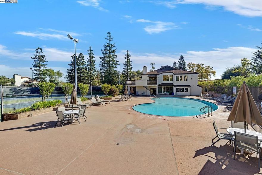 Get that vacation/resort feeling in your own home! Upper-level Mesa Verde condo with detached 1 car garage and no neighbors above unit. Gated community with many amenities: 5 pools, gym, clubhouse, tennis courts & clubhouse. Unit is well kept and features granite counters in kitchen. All appliances including stack washer & dryer/ 2nd bedroom has bayed windows. Primary bedroom has mirrored closets and adjoining main bath. Spacious living room with fireplace and slider to balcony. 2 dining areas (breakfast bar and dinette area) HOA covers exterior maintenance, water and garbage. Great location near 580/238 corridor, Downtown shopping and dining, BART and Lake Chabot. Unit is virtually staged. FHA financing available.