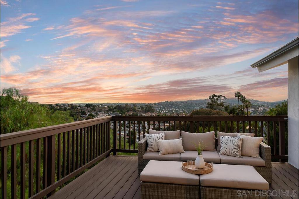 Panoramic views toward Mt. Helix greet you the moment you step inside, with peekaboo glimpses of downtown and the ocean adding to the home’s sense of quiet luxury. Vaulted ceilings and large and open windows frame weeping willows, while golden hour light pours through nearly every room. Like a hidden European getaway tucked in the hills, the home is thoughtfully oriented for privacy and peace. Every window looks out—not in—framing nature, not neighbors. You’ll feel it right away: quiet, spacious, calm. Enjoy the ease of a countryside retreat with city life just around the corner. You’re 20 minutes from downtown, the airport, and the beach. La Mesa Village is 10 minutes away for coffee runs and Friday farmers markets. A detached front studio offers flexible potential—ideal as a home office, yoga, or art space. Plans exist to expand the lower level into additional living area or a future ADU. Mature trees, a winding path, and spaces to plant, relax, or create—the outdoor area is ready to enjoy now, yet still full of potential. Add a garden, a pool, or make it uniquely yours. Major upgrades complete: New vinyl floors, New HVAC & ducting,New roof, and New TREX deck. FYI there are 3 decks, one off the living room, one off the primary and one in the backyard. If you’ve been searching for character, light, vaulted ceilings, retreat vibes, and panoramic views—this is the one.