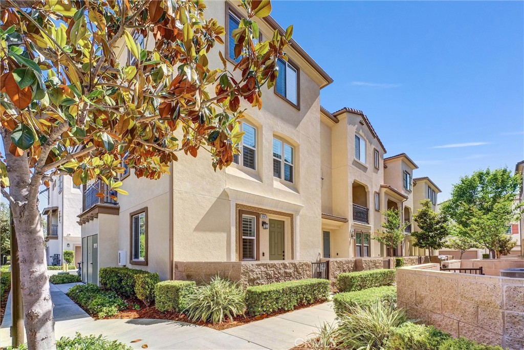 Discover this charming, highly upgraded tri-level townhome nestled in the prestigious Nexus gated community, offering resort-style living. This turnkey end-unit features four bedrooms, including a first-floor bedroom with a full bath, and three and a half bathrooms, along with a 2-car attached garage. The modern open-concept floorplan boasts upgraded plantation shutters throughout, and gorgeous wood laminate flooring on the second floor, a spacious living/dining area, and an oversized island in the fully renovated kitchen with quartz countertops, decorator tiled backsplash, stainless steel appliances including a double oven, dual pantries, and a private laundry room. To complete the upgrades this home has a whole house Lifesource water softener system. Natural light floods the home through recessed lights and dual-pane windows. The third floor hosts a beautiful primary bedroom with a walk-in closet and dual sinks, plus two additional bedrooms with their own full bathrooms. Enjoy outdoor living with patios on both the first and second floors. Paint has been recently touched up and has freshly cleaned carpeting, this stunning home is conveniently located near shopping, entertainment, restaurants, and major freeways, and is part of the highly desirable Roosevelt High School district—truly a must-see!