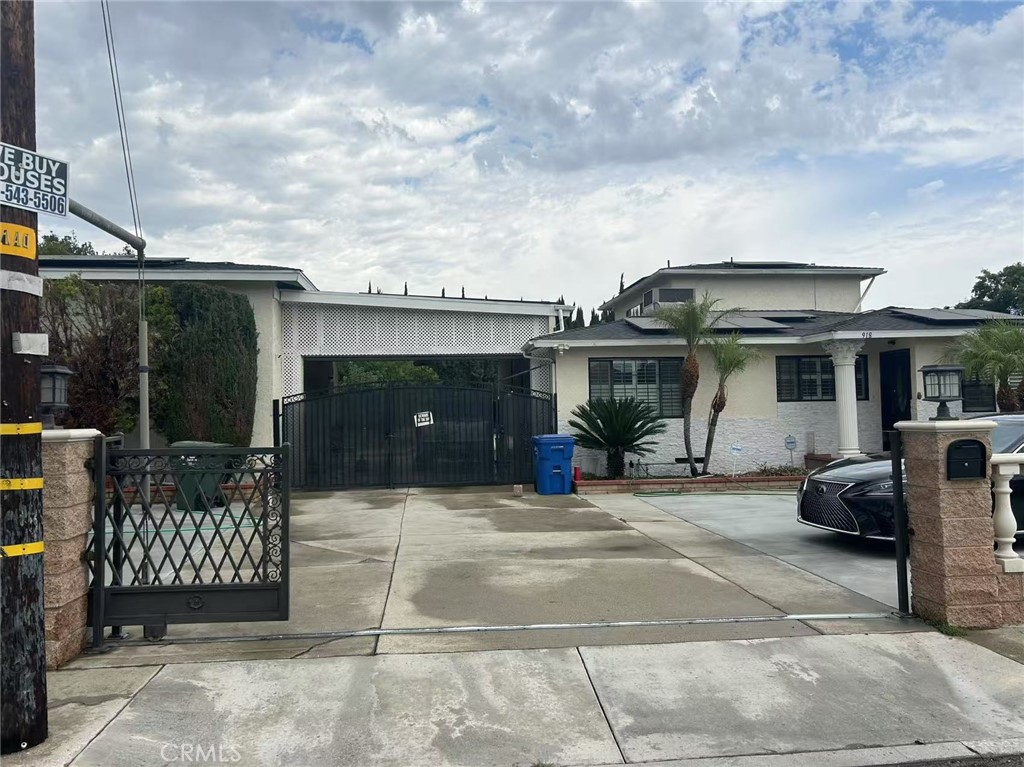 Nestled in a preferred location of Pomona, this home evokes feeling of being gracious in its time. Opening onto its wonderful entertaining space are the living room, family room, and highly upgraded kitchen. Lots of Bay Windows throughout, travertine flooring in family room, perfect for any family. The kitchen boasts custom granite countertops with full backsplash, cabinets, and top of the line stainless steel appliances. Access to a private courtyard is just waiting for your vision... swimming pool, gardens, Bar-B-Q area, sanctuary... almost anything you can imagine. The kitchen and family room open onto a gardened area offering beauty during the day and at night. Its custom built garage can fit 2 RVs and still have much space, it almost simulates a jet hangar. This home truly offers feeling of luxury living