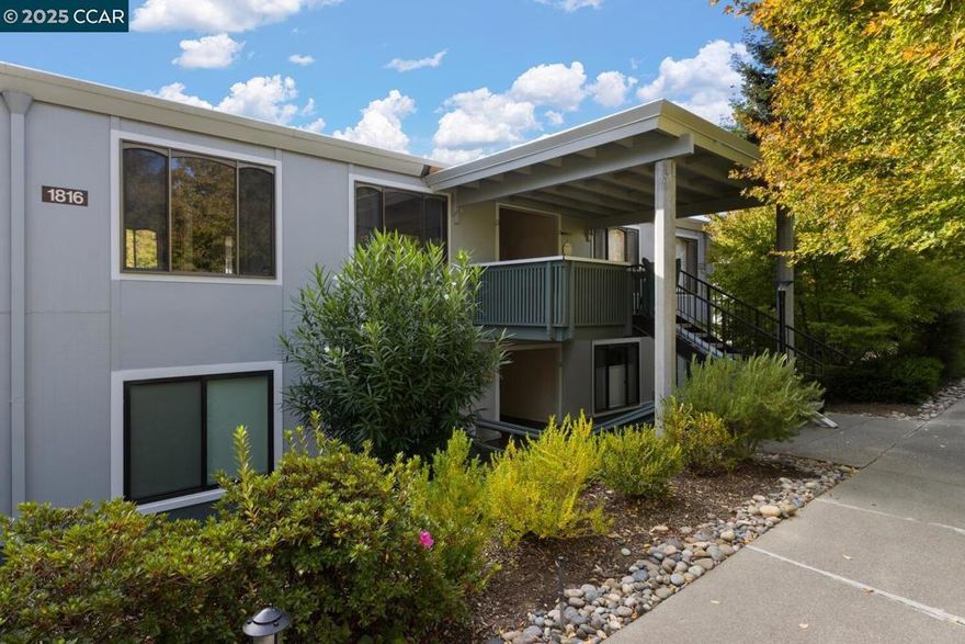 Welcome to the thriving community of Rossmoor! Step into this 2 bed/1 bath meticulously maintained Sequoia. This move-in ready unit features granite countertops and tiled backsplash in kitchen, new carpet and paint throughout, mirrored closet doors, stacked washer/dryer and stall shower.  Views of the valley from the deck. Carport (with extra storage), guest parking and bus stop close by. Rossmoor offers so much more than just a place to live! Fitness center, pools, movie theater, pickleball, tennis, golf, walking trails, clubs and so much more. Whether you prefer relaxing in the peace of your home or engaging in the multitude of activities, you will love calling Rossmoor home.