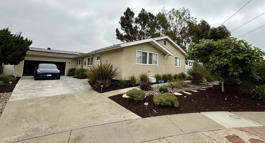 Welcome to 8796 Regency Rd – an exceptional single-story home located in the heart of Serra Mesa, offering comfort, flexibility, and room to grow. This beautifully maintained 4-bedroom, 3-bath residence spans approximately 1,700 square feet of permitted living space, thoughtfully designed for both everyday living and entertaining. In addition, a 380 sq ft enclosed sunroom (not permitted, included in estimated ESF) provides valuable bonus space ideal for a family room, gym, or playroom. The home features a functional floor plan, with a private bedroom and bath setup perfect for multigenerational living or guests. Enjoy the benefits of a newer roof, leased solar system, HVAC, replaced all pipes to the house and a two-car garage with an extra 220 volt plug for EV's and offering ample storage. Situated on a generously sized lot, the outdoor space invites endless possibilities — from adding a pool or ADU to creating your dream backyard retreat. Nobody will build behind the property, the land is owned by SDGE. Thoughtfully refreshed,: kitchen tile, painted cabinets, entire interior painted and move-in ready, this Serra Mesa gem combines space, efficiency, and potential in one of San Diego’s most central communities. Located on a quiet street at the end of a Cul-de-sac in a well-established neighborhood, this home offers unmatched convenience to Mission Valley, Snapdragon Stadium, shopping, dining, and major freeways — all just minutes away.