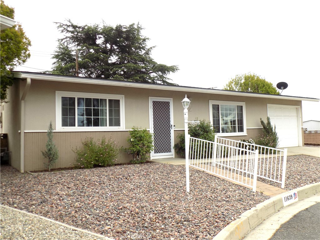 Cozy single story home located in the 55+ community of Sun Park 1 in upper Yucaipa on a quite cul-de-sac, This is a wonderful home boasts great character with two bedrooms and one full bathroom, living/dining room and nice kitchen with oak cabinetry. Property features freshly cleaned carpets and tile flooring throughout, Updated Dual pane windows, new heater and air conditioning that’s only one year old, additional closet space in hallway and tiled backsplash with tile flooring in the bathroom/shower area. This home comes with refrigerator + washer and dryer. Step out into your fully enclosed patio that features it own a/c vent, separate laundry room with sink and additional toilet. This fully enclosed patio could be used for an additional room for entertaining or having quests stay over. This wonderful home also features a larger lot than most in the community with over 5,000 square feet you will enjoy the fully landscaped backyard with lush trees and rose bushes. Take advantage of the community features and amenities that are just a few steps away from your new home to include: clubhouse with workout equipment, pool table, putting green, pool, and outside fire pit all this plus its conveniently located to nearby stores, historic down town Yucaipa shops and the Yucaipa regional park. Come see this great home today!!!