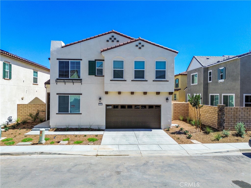Welcome to your brand-new dream home in Menifee! This stunning 4 bedroom, 3 full bath residence offers over 2,200 sq ft of modern living space with a bright, open design perfect for today’s lifestyle. Step inside to find sleek vinyl plank flooring throughout the main level, with plush carpet on the stairs and upstairs. The gourmet kitchen boasts shaker-style dark cabinetry, stainless steel refrigerator, and an open layout flowing into the spacious living area, perfect for entertaining. A downstairs guest bedroom with full bath provides convenience and flexibility. Upstairs, enjoy a versatile loft, convenient laundry room, and two additional bedrooms connected by a full bath. The expansive Primary Suite is your private retreat with a soaking tub, separate shower, dual sinks, and a massive walk-in closet. The backyard features a wrap-around space ready for your outdoor vision. With fully paid solar, you’ll enjoy energy savings year-round. Community amenities include a sparkling pool, play area, Zen garden, and guest parking just steps away. Located in a quiet family-friendly neighborhood, close to schools, grocery stores, parks and Dropzone Waterpark just a 10-minute drive away. Don’t wait! Homes like this move fast! Schedule your appointment today and make this Menifee gem yours before it’s gone!