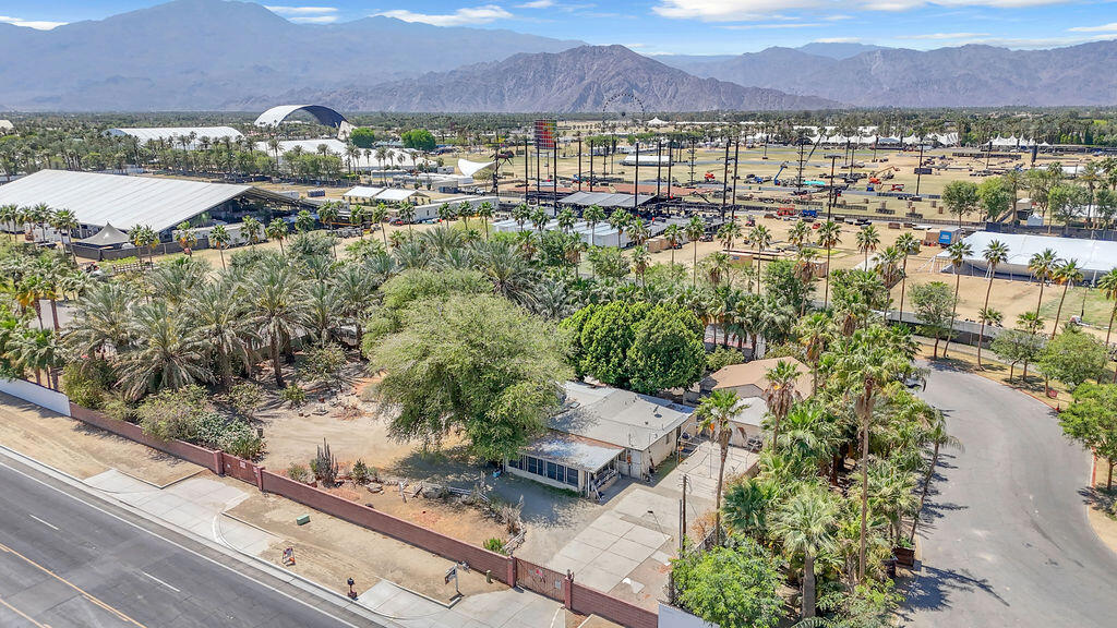 50351 Monroe St. isn't just a home--it's an opportunity unlike any other in the Coachella Valley. Surrounded on three sides by the iconic Empire Polo Grounds, this property places you in the heart of one of the most sought-after entertainment destinations in the world. Yes, that Empire Polo Grounds--home to the Coachella and Stagecoach music festivals. From the backyard, you can see stages and feel the energy that brings thousands to the desert every year. Set on nearly 0.74 acres, this single-story home offers approximately 2,552 square feet of space with 3 bedrooms and 1.5 bathrooms. The interior is in original condition, making it a rare blank canvas for someone ready to reimagine its potential. Whether you're envisioning a personal retreat, a vacation rental, or something entirely unique, the location alone opens the door to countless possibilities. Properties with this kind of proximity, privacy, and potential almost never hit the market. This is more than a renovation project--it's a chance to create something extraordinary in a location that's truly one-of-a-kind!