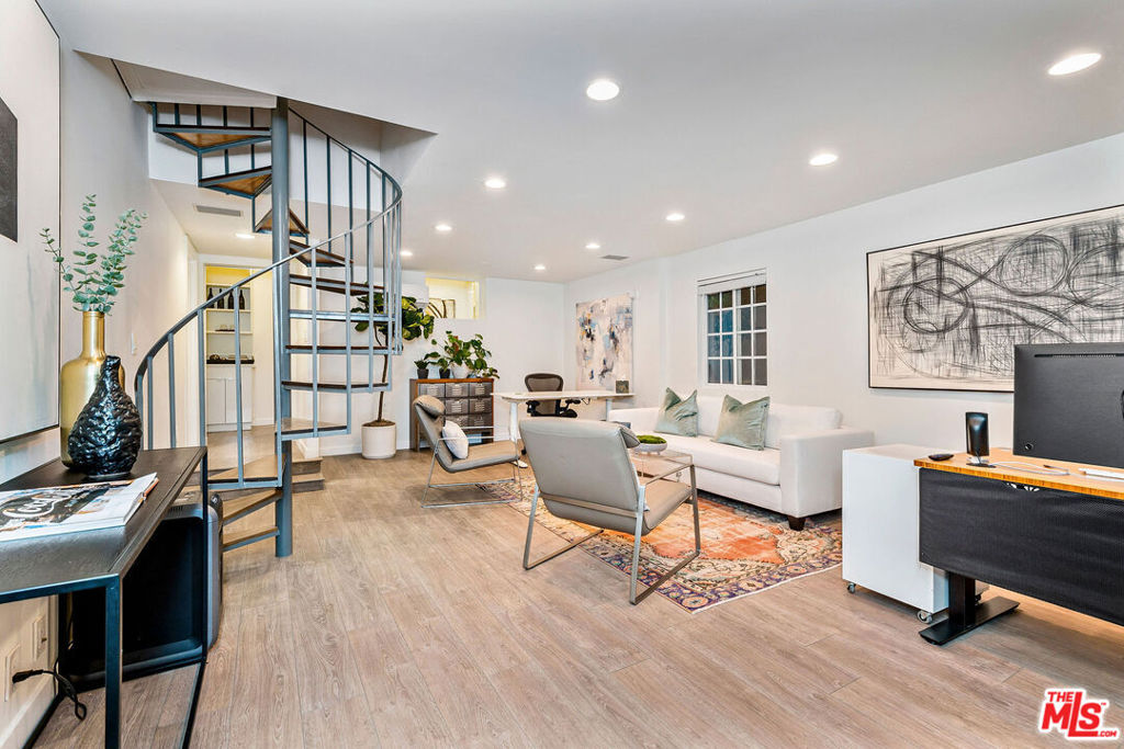 Welcome to 717 1/2 Huntley Drive, a fully furnished two-story townhouse-style unit in the heart of West Hollywood. This well-maintained home features two full kitchens and a smart layout designed for comfort and convenience. The main level includes an open living area with high ceilings, hardwood floors, and large windows that bring in plenty of natural light. The kitchen offers modern countertops, ample cabinet space, and all the essentials. A half bathroom is also located on this level. Upstairs, you'll find a spacious bedroom with a large closet and an en-suite bathroom with updated fixtures and a walk-in shower. The second kitchen on this floor adds flexibility--ideal for entertaining or extended stays. Located in a highly walkable area of West Hollywood (Walk Score: 91), you're close to popular shops, restaurants, and entertainment. This is a great opportunity to enjoy a comfortable home in a central and vibrant neighborhood. Property will be offered furnished.