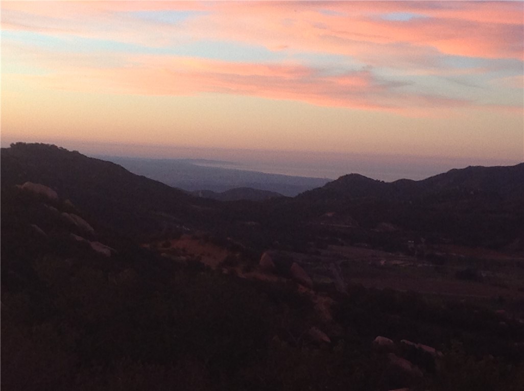 20.26 Acres of Scenic Land in Murrieta CA. Discover a rare opportunity to own a piece of history and unparalleled beauty in Murietta, CA. Nestled within the original Ronald Regan Ranch, this 20.26 -acre parcel offers breathtaking views and a unique blend of natural charm and historical significance. Located in La Cresta Murietta, CA 92562, this expansive property is zoned R-A-5 and boasts convenient access via the closest paved road. Calle Parama. The lot is reachable with a 2 WD vehicle, although a 4WD may be needed to reach the uppermost pads. Utilities are readily available with water and power on Calle Parama. Additionally, the property features an agricultural well on the western border, producing 2-3 gallon per minute with solar power and extending 500 ft deep. The parcel offers enchanting views in every direction. To the South you can overlook the ocean and La Jolla Bay.