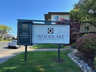 Welcome to Woodlake! Experience a resort-style living at Woodlake with this spacious ground-floor unit. This floor plan offers one large bedroom and one full bath with lots of windows for great sunlight and a large living room that leads you to your exclusive patio. This unit is move-in ready with new carpet in the rooms and hardwood floors in the kitchen as well as fresh paint throughout. This unit comes with one external storage space and one covered parking space. It is in close proximity to the washer and dryer and is directly across from the elevator. The complex has amazing amenities including 6 pools, 4 tennis courts, a clubhouse, gym, jacuzzi, sauna, playground, and beautiful walking paths around the lake.