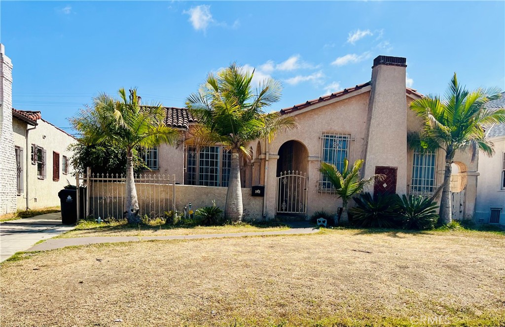 Discover a fantastic opportunity to create your dream home in this delightful single-level Spanish style residence. Offering over 1,700 sq. ft. of living space, this property features 3 spacious bedrooms and 1.5 baths. The inviting living room boasts a high beamed ceiling, lots of natural light, a cozy wood-burning fireplace, and original hardwood flooring throughout, exuding warmth and character. Enjoy meals in the bright breakfast nook just off the kitchen, or entertain guests in the formal dining room. The separate laundry room, conveniently located adjacent to the kitchen, adds to the home’s functionality. A long driveway leads to a detached 2-car garage at the rear of the property, providing ample parking for 4-5 cars. Additionally, a small guest unit attached to the garage offers extra space for visitors or potential rental income. With some TLC and your personal touch, this home has the potential to become a true showpiece. Ideally situated just minutes from the vibrant Inglewood entertainment district, Sofi Stadium, Intuit Dome, Kia Forum, IMAX Cinepolis, and Youtube Theater. Enjoy easy access to shopping, dining, LAX, Downtown LA, and major freeways. Don’t miss out on this incredible opportunity—schedule your private tour today!