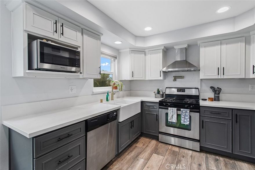 Welcome to your dream home! This two-story townhome has been beautifully updated and boasts 3 bedrooms, 2.5 baths in the desirable Citrus Grove East neighborhood. The inviting renovated kitchen shines with a huge farmhouse sink, a pot-filler over the stove, and a large vent hood, perfect for culinary enthusiasts. Enjoy easy freeway access, making commutes to Glendale, Eagle Rock, and Pasadena a breeze. Step inside to discover stunning new laminate flooring in the stairway and upstairs bedrooms, while the unique herringbone wood floor in the living room showcases the craftsmanship of a skilled woodworker. Cozy up to the working gas fireplace that adds warmth and character to the space. The home has been thoughtfully updated with a new A/C unit installed in 2020, and just three years ago, brand new Milgard double-paned windows were added for energy efficiency and sound insulation. The convenient laundry room is just 5 feet from the front door and includes two washers and dryers for your convenience. There are 2, side-by-side, parking spaces directly below the unit with plenty of room for storage.  Enjoy breathtaking views from the property, looking east toward Eagle Rock and the stunning California sunrise. This home is truly a gem, ready for you to make your own.
