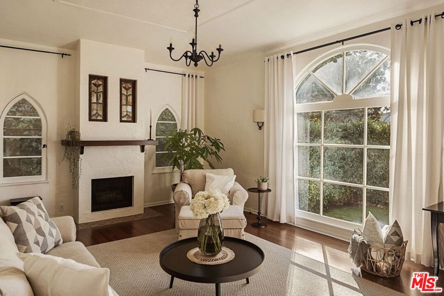 Just beyond the hum of West Hollywood, where the rhythm of Santa Monica Boulevard meets the style of Melrose Avenue, Las Casitas de la Bougainvillea awaits in quaint Melrose Village. This intimate 1920s Spanish Revival compound channels cinematic charm through a contemporary lens. Beyond its gated entrance, three private residences curve around a lush central courtyard garden, forming a hidden sanctuary where time slows and beauty lingers in every corner. The front-facing casita, a FULLY FURNISHED 1BD, 1BA residence spanning 800 square feet, enjoys a private grassy yard framed by tall hedges, complete with a gravel patio ideal for alfresco dinners or unhurried Sunday mornings under the sun. Inside, timeless character meets elevated comfort. Sunlight dances across stained-glass windows, 10-foot coved ceilings rise overhead, and textured plaster walls add depth and warmth. A decorative fireplace anchors the living room, while hardwood and terra-cotta floors ground the space in authenticity. The fully-stocked kitchen blends form and function with modern appliances, cookware, and dining essentials perfect for coffee-fueled mornings or candlelit evenings in. Everyday comfort continues with a private laundry room, generous storage, and thoughtful turnkey touches throughout. Step outside into the common courtyard, where roses burst with color and lavender, bougainvillea, and citrus trees perfume the air, offering a serene escape that feels worlds away from the city, yet just moments from its pulse. All city utilities are included, along with bi-weekly maid service. Street parking only. Available November 5, 2025.