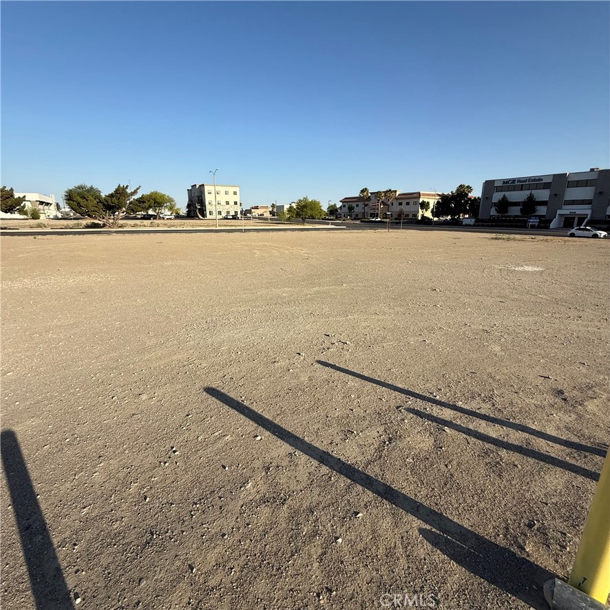 Premier Commercial Property at Civic Business Park – Victorville, CA Discover an exceptional opportunity to own prime commercial real estate in Civic Business Park, one of Victorville’s most desirable and fastest-growing business hubs. Strategically located just off Interstate 15, this best-in-class location offers unparalleled visibility, easy freeway access, and a professional setting ideal for corporate headquarters, office or mixed-use development. With direct Freeway Frontage, you'll have Immediate access to I-15, connecting you to the Inland Empire, Las Vegas and beyond. Zoning is Versatile commercial zoning to accommodate a wide range of business uses (Buyer to verify) Situated in one of the High Desert’s most active development corridors with nearby national retailers, government buildings, and medical centers. This Property has top tier Visibility & Access, High traffic counts, prominent signage opportunities, and seamless commuter access. Whether you're looking to establish your flagship office, expand your logistics footprint, or invest in Victorville’s booming commercial market, this Civic Business Park property offers location, prestige, and long-term growth potential. This property can be sold together with adjacent lots APN: 039614206, 039614207 & 039614208 for a total of 1.21 Acres/52,500 Sq Ft