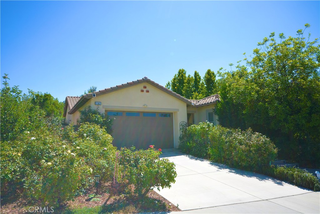 Incredible opportunity to own this formal model home - a single level on a 1/4 acre lot, LOADED with amazing upgrades and built ins, all at a price that won't break your budget! Top rated Temecula schools, 4 bedrooms, 3 bathrooms, and gated, private front courtyard! Enter to the grand foyer next to an impressive formal dining room with floor to ceiling built-ins, wine racks and wine fridge. Rear of the home is an expansive great room with a well-appointed kitchen and breakfast nook, with center island, pantry, upgraded appliance package, loaded with cabinet and counter space. All of this open to the family room with more luxury built-ins, fireplace and more. Spacious primary suite with luxury 5 piece bath, island soaking tub and walk in closet. Down the hall, secondary bedrooms and bathrooms, and a show stopping den/family room with built in cabinetry, couch surround, theater speakers and space for large TV. Quiet location close to parks, schools, shopping and award winning wineries. Easy freeway access for commuters to both the 15 and 215 freeways.
