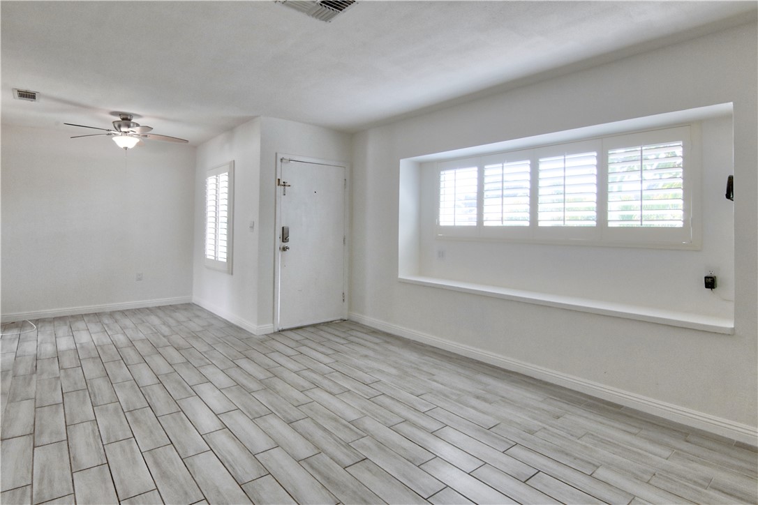 Don't miss the virtual link & the opportunity to move into this quiet North Long Beach neighborhood. 3 bed and 3 full bath in the main home with solar panels and will partially cover your monthly electricity costs. Large family room with ceramic tiles, multiple windows and plantation shutters. Kitchen has quartz counters, stainless steel undermount sink, recessed lights, and large stainless steel appliances. All 3 bedrooms are comfortable sizes with lots of light. Primary bath has a large jacuzzi tub, 2nd bedroom suite has a large walk-in shower, and the hallway bath has a standing shower & a separate soaking tub. Central AC & heating as well. The patio has outdoor kitchen island as well as a large open patio in the rear great for outdoor entertainment. Bonus outdoor bath as well as large exterior laundry room! Garage has been converted to a semi-work / hang out / live space with a nicely finished bonus room & an additional rear storage room. Come see to appreciate everything the home has to offer.