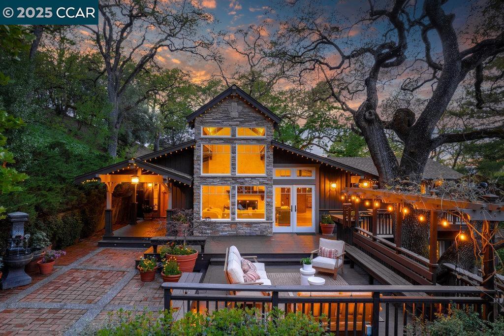 Nestled among majestic oaks, this serene two-story treehouse like home blends charm and functionality with ultimate privacy living above it all with a peek of Mt. Diablo. The gourmet kitchen features a spacious island, gas stove and custom cabinetry. A wood-beamed vaulted ceiling enhances the open living/dining area, where natural light illuminates a grand stone wood and gas fireplace. A mix of hardwood and carpet complete all the living spaces. This structurally sound home has concrete caissons and steel beams. Outside, endless possibilities await. At the house level, there is a two-car garage with built-in cabinets and ample guest parking. Expand your outdoor living space with hundreds of square feet of deck and garden. Just below the house is a rentable studio cottage. At the street level .9 acres of flat lot are ready to be developed as family recreation, vineyard or sustainable farm. Zoned as agriculture provides ultimate flexibility. Current structure, on this lot, protects a 100-year-old barn and supports 38 solar panels. Landscape irrigation supplied by a well adds to the property’s sustainability. This peaceful retreat is just minutes from town, top-rated schools, and 680 freeway access. A rare opportunity to own a private oasis with endless potential.