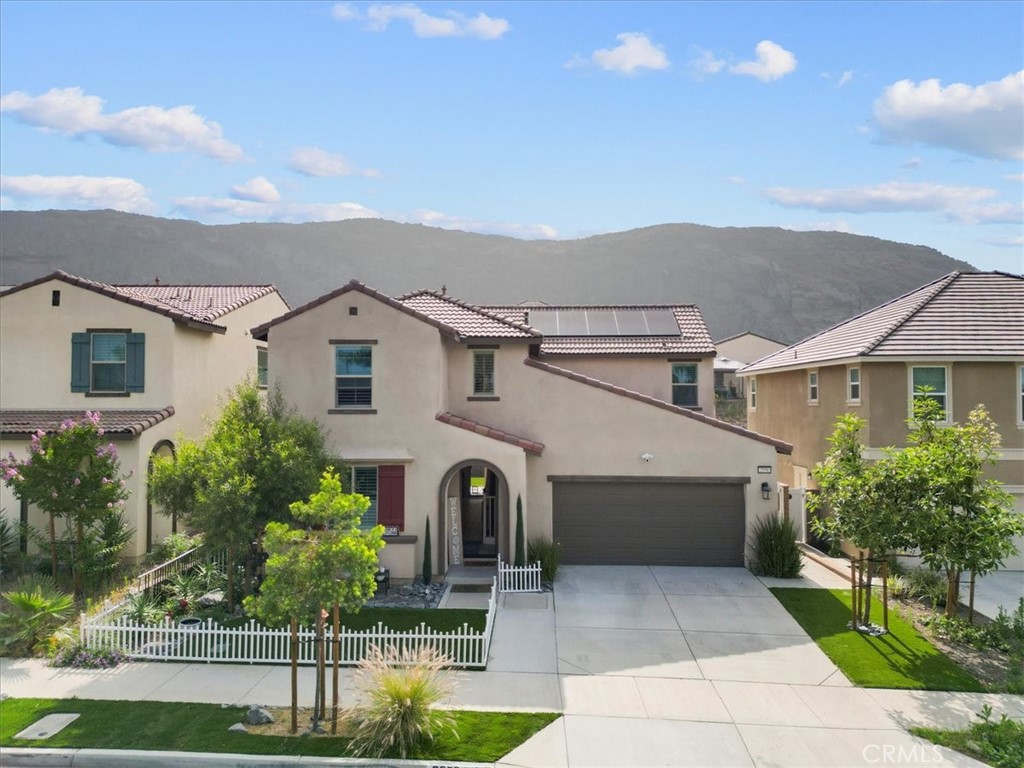 Welcome to your dream home! This beautifully maintained two-story residence offers 4 spacious bedrooms, 3 full bathrooms, and 2,202 square feet of thoughtfully designed living space — all with NO HOA! Step inside to find elegant tile flooring, plantation shutters, and an extended tiled dining room perfect for gatherings. The open-concept layout flows seamlessly into a stylish kitchen and living area designed for both comfort and entertaining. Upstairs, the master suite is a true retreat with custom French doors opening to a private balcony. The spacious upstairs loft offers endless possibilities- perfect as a second living area, home office, playroom, or entertainment space. The backyard is your personal oasis, featuring low-maintenance artificial grass, a custom retaining wall with proper drainage, and a covered patio with built-in Bluetooth speakers, lights, and fans—ideal for enjoying year-round outdoor living. Additional features include: Smart door lock for modern convenience. Cement walkways with drains around the house for durability and function. Curb appeal galore with a fully landscaped front yard featuring artificial grass. This home combines luxury, practicality, and technology—all with no monthly HOA fees. Don’t miss this opportunity to own a move-in-ready, newly built home in a highly desirable neighborhood.