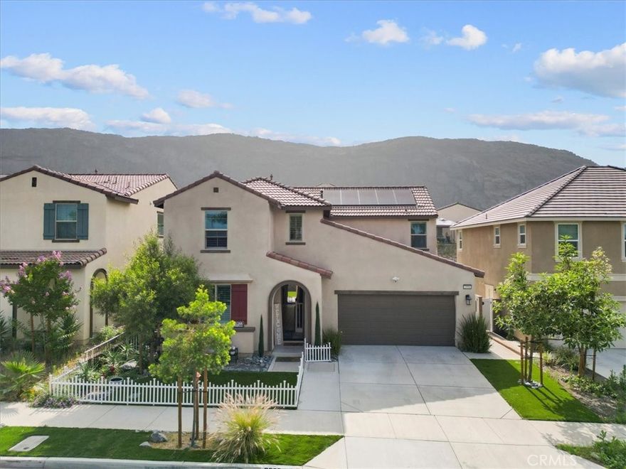 Welcome to your dream home! This beautifully maintained two-story residence offers 4 spacious bedrooms, 3 full bathrooms, and 2,202 square feet of thoughtfully designed living space — all with NO HOA! Step inside to find elegant tile flooring, plantation shutters, and an extended tiled dining room perfect for gatherings. The open-concept layout flows seamlessly into a stylish kitchen and living area designed for both comfort and entertaining. Upstairs, the master suite is a true retreat with custom French doors opening to a private balcony. The spacious upstairs loft offers endless possibilities- perfect as a second living area, home office, playroom, or entertainment space. The backyard is your personal oasis, featuring low-maintenance artificial grass, a custom retaining wall with proper drainage, and a covered patio with built-in Bluetooth speakers, lights, and fans—ideal for enjoying year-round outdoor living. Additional features include: Smart door lock for modern convenience. Cement walkways with drains around the house for durability and function. Curb appeal galore with a fully landscaped front yard featuring artificial grass. This home combines luxury, practicality, and technology—all with no monthly HOA fees. Don’t miss this opportunity to own a move-in-ready, newly built home in a highly desirable neighborhood.